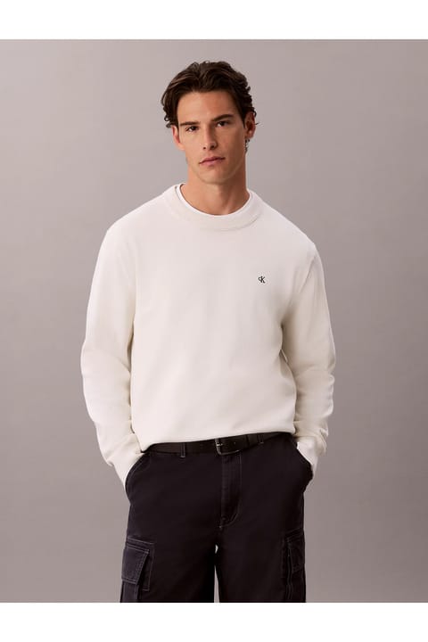 پلیور کرم مردانه Calvin Klein با لوگوی برند مناسب استفاده روزمره