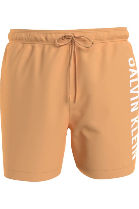 شورت ساحلی مردانه Calvin Klein با لوگو، پلی‌استر سریع‌خشک — Turuncu Deni
