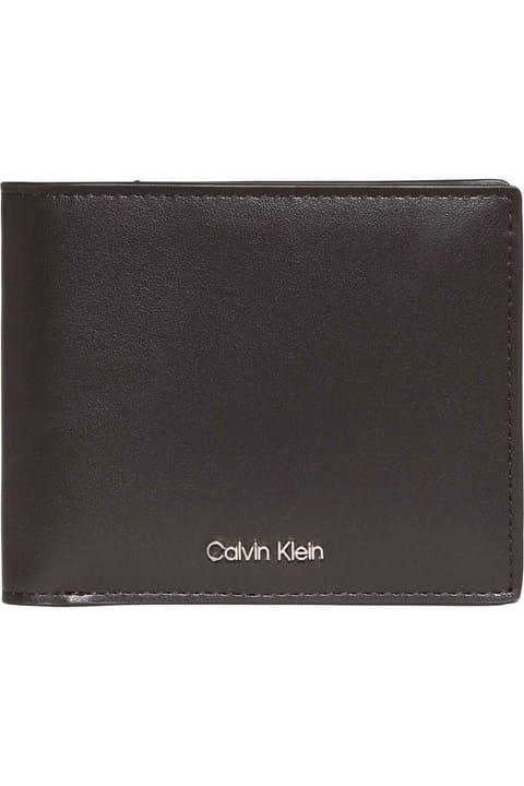 کیف پول مردانه Calvin Klein قهوه‌ای تیره با لوگوی برند مناسب استفاده روزمره